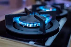 kitchen stove with blue flames